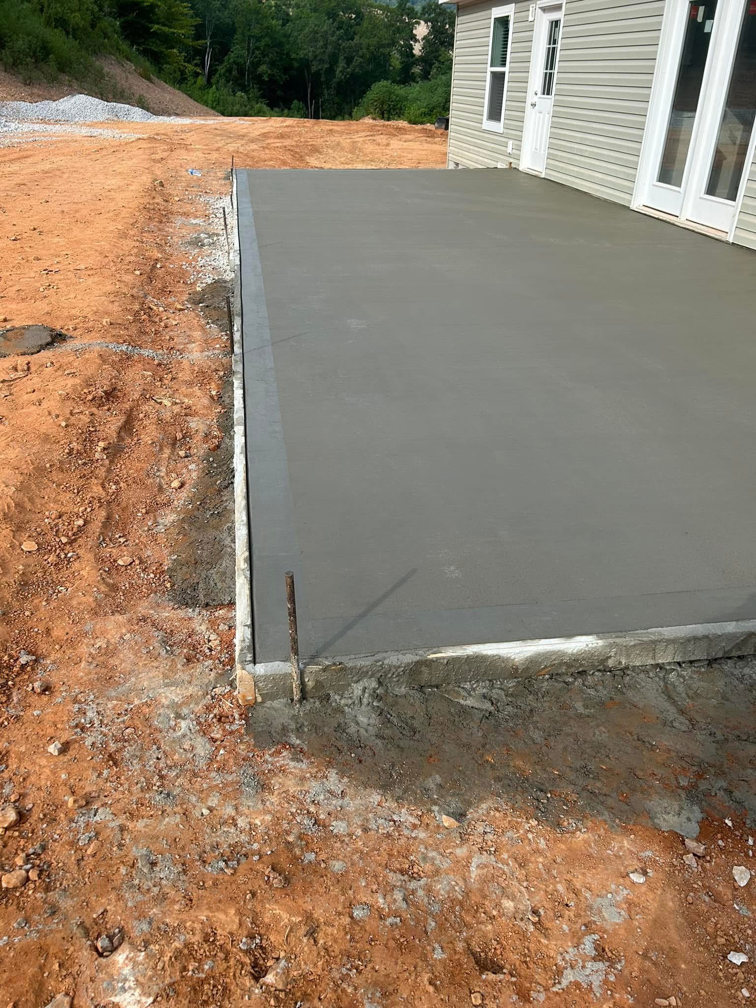 Finished concrete pad and graded site