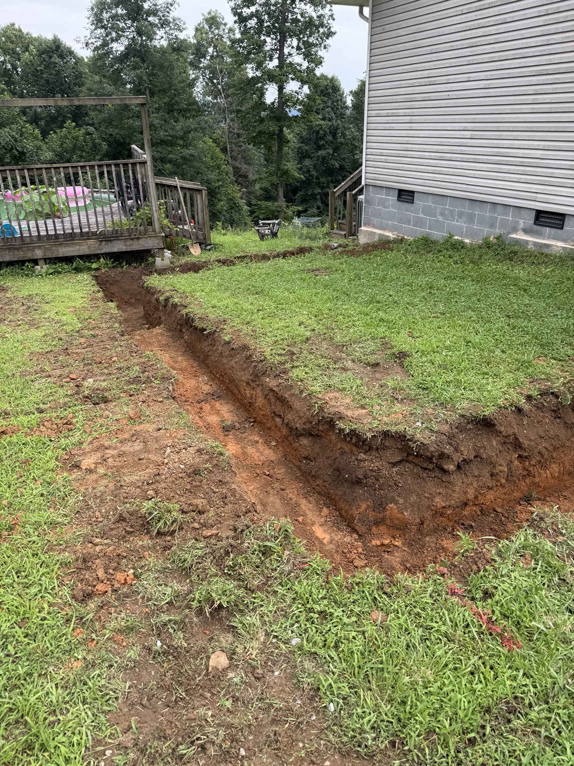Residential trench excavation through a yard